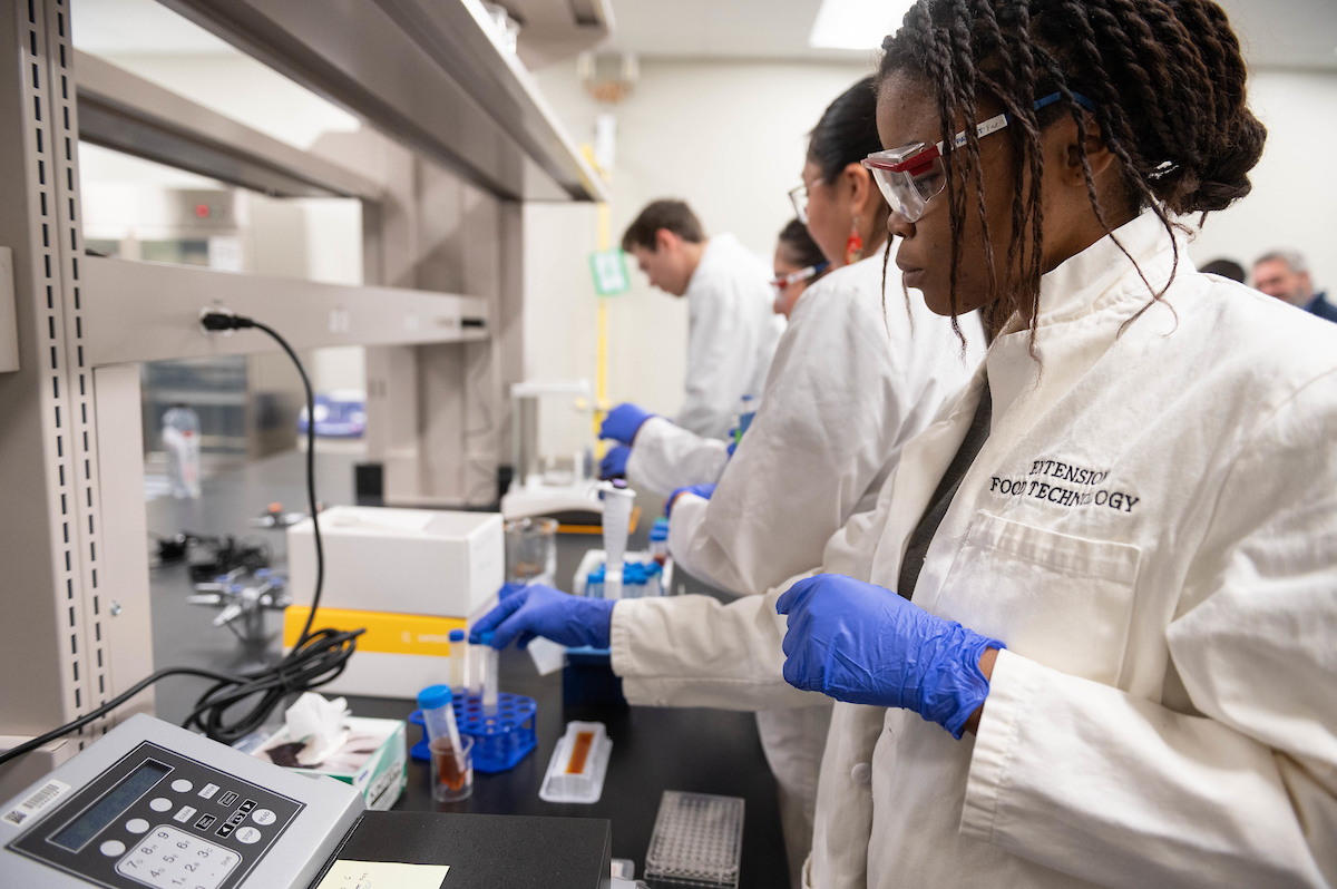 NMSU students in a food science lab.